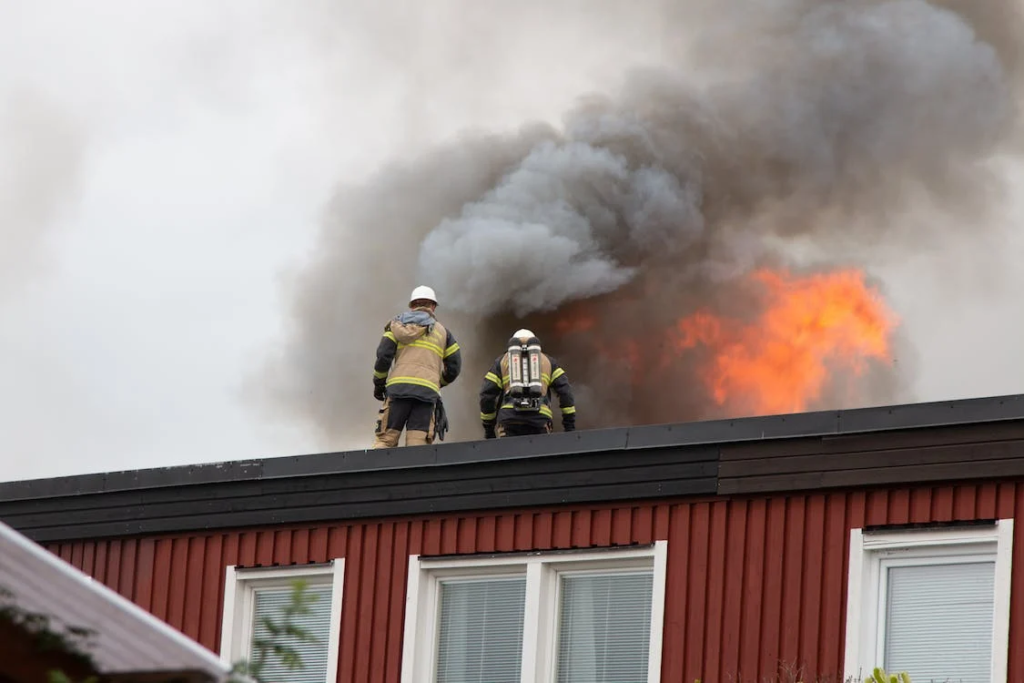 Professionals associated with a fire protection service provider visiting a building on fire