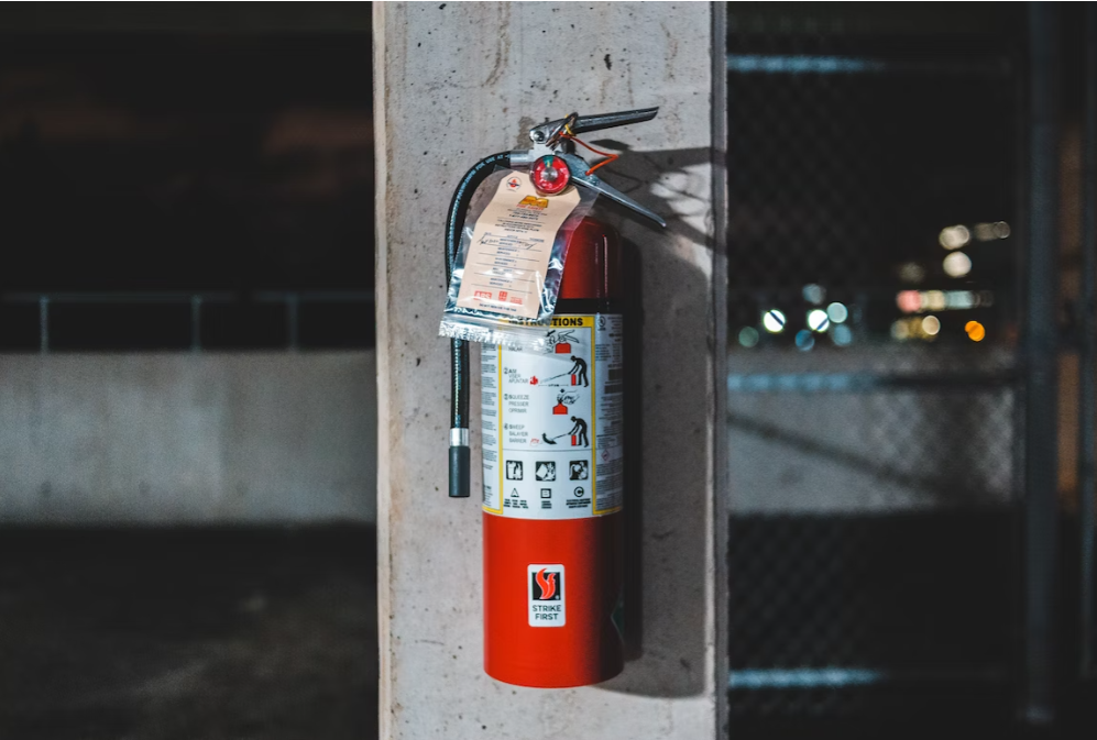 Fire extinguisher mounted on a pillar. 