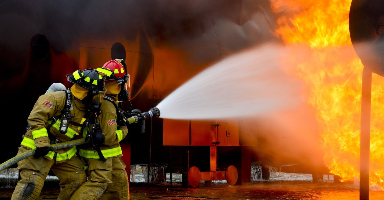 firefighter trying to put out a fire